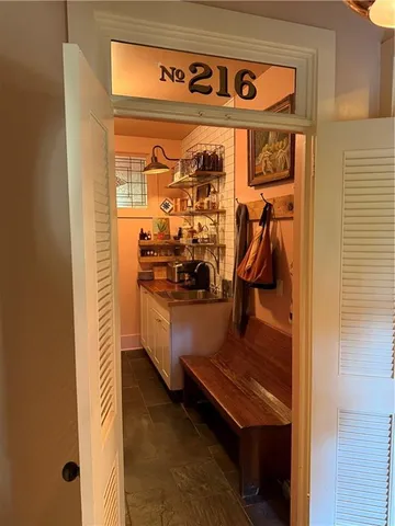 a living room with furniture a fireplace and flat screen tv