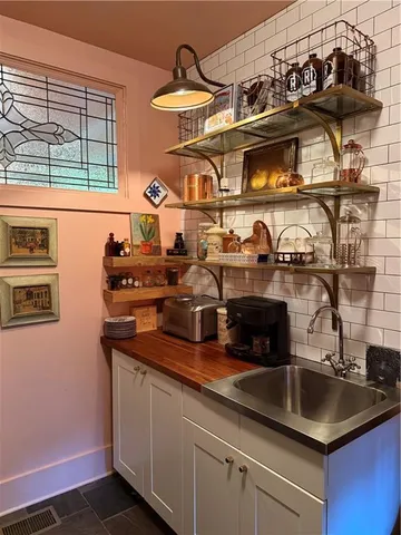 a dining room with furniture and a window
