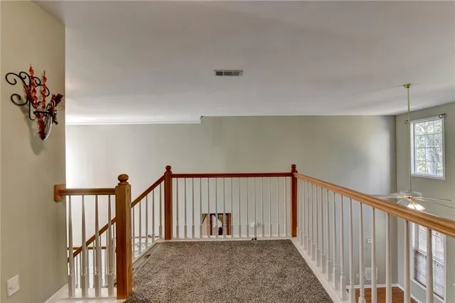 a view of a hallway with windows