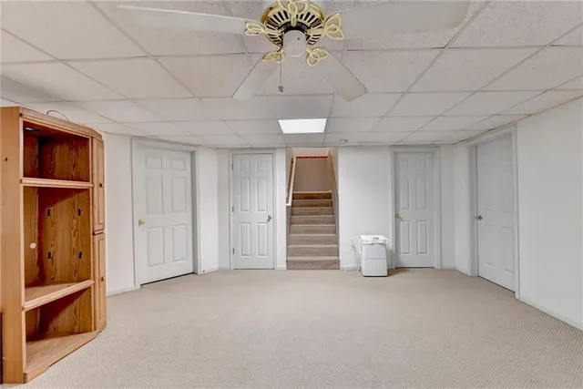 a view of empty room with ceiling fan