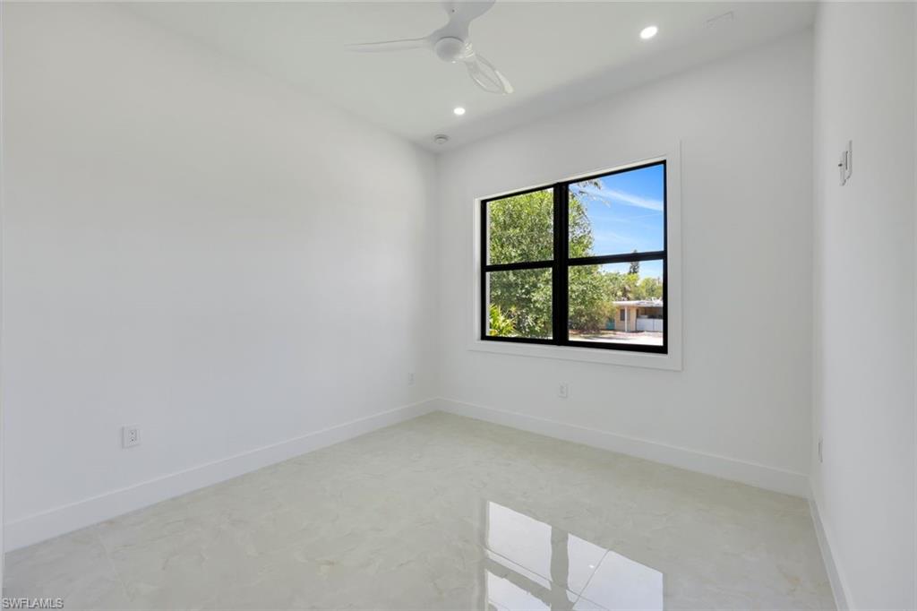 1312 Trail Terrace Drive Naples, FL 34103 - Photo 19 of 33 an empty room with a window