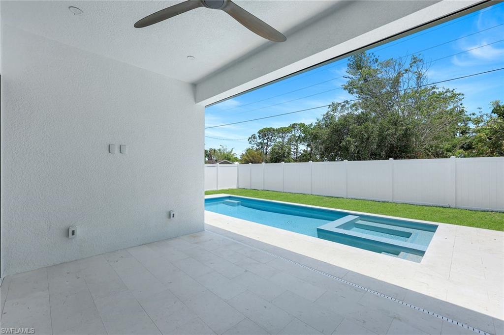 1312 Trail Terrace Drive Naples, FL 34103 - Photo 22 of 33 a bathroom with a bathtub and a window