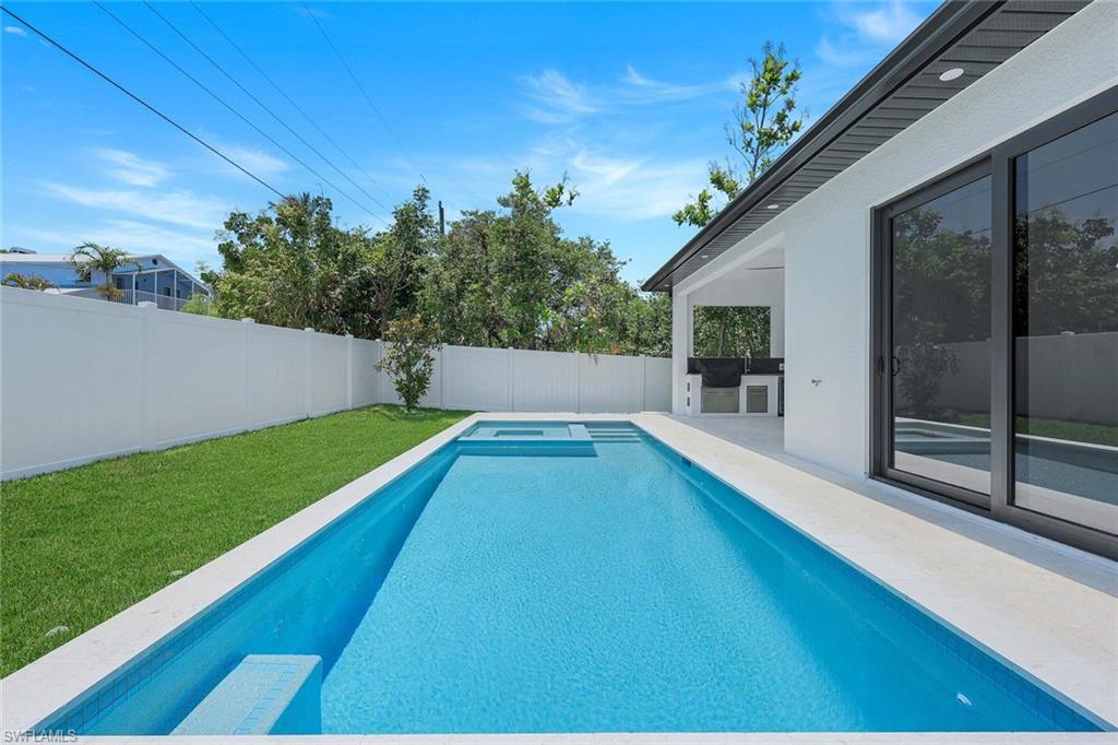 1312 Trail Terrace Drive Naples, FL 34103 - Photo 26 of 33 a view of a backyard with a garden