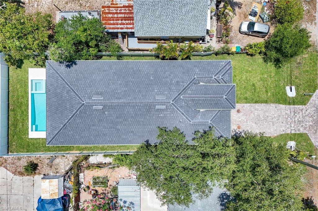 1312 Trail Terrace Drive Naples, FL 34103 - Photo 32 of 33 an aerial view of a house with a garden and a yard