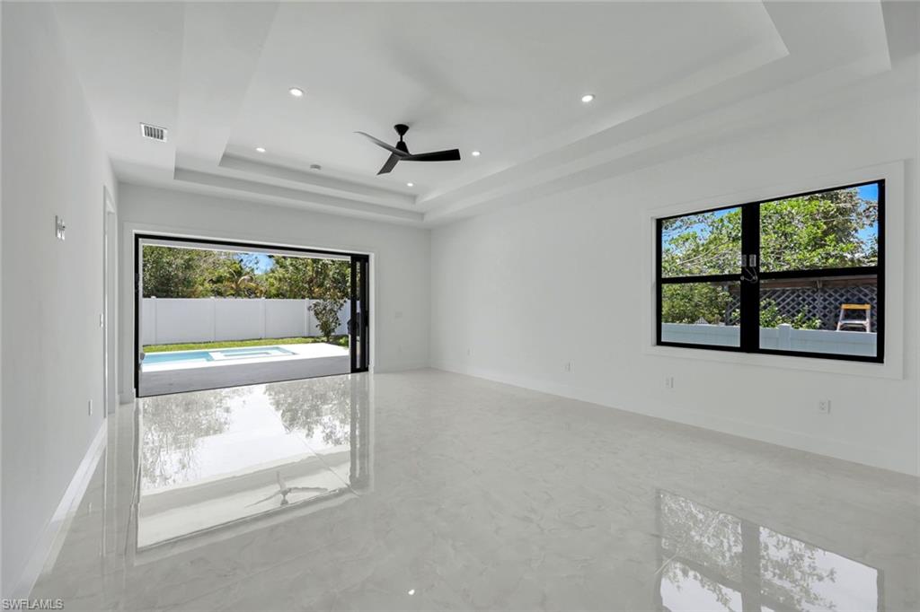 1312 Trail Terrace Drive Naples, FL 34103 - Photo 5 of 33 a view of an empty room with a window