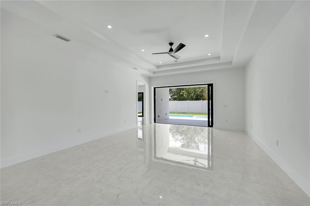 1312 Trail Terrace Drive Naples, FL 34103 - Photo 6 of 33 an empty room with a empty space and windows