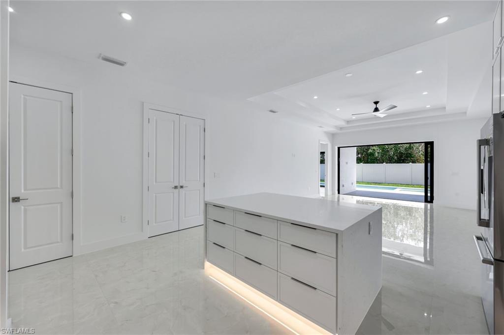 1312 Trail Terrace Drive Naples, FL 34103 - Photo 9 of 33 a bathroom with a sink and a mirror