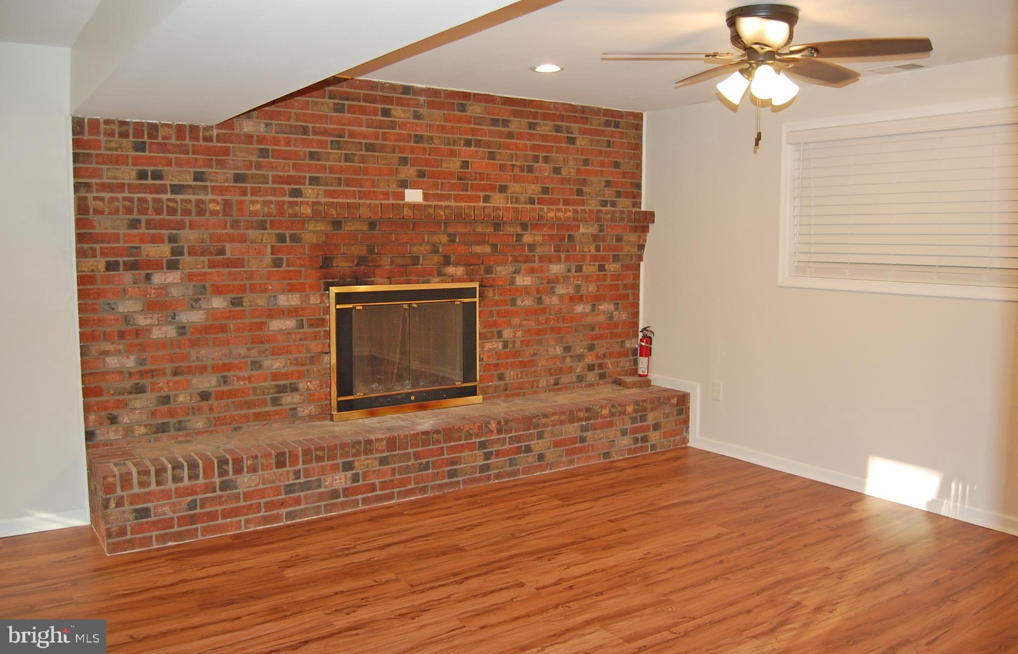 756 Stinchcomb Road Severna Park, MD 21146 - Photo 16 of 35 Brick wood burning fireplace