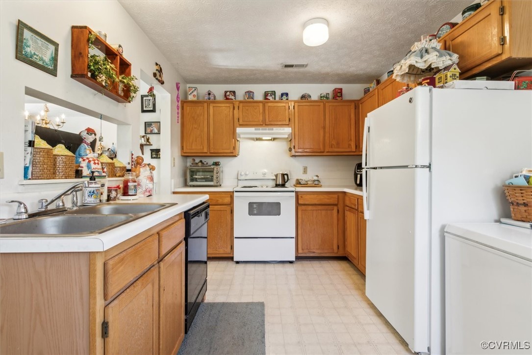 147 Rain Tree Way Williamsburg, VA 23188 - Photo 14 of 36 a kitchen with a white stove top oven and refrigerator