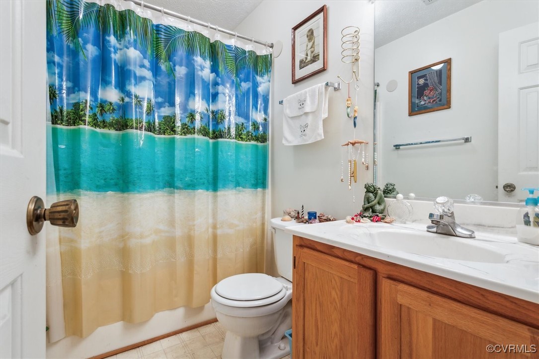 147 Rain Tree Way Williamsburg, VA 23188 - Photo 18 of 36 a bathroom with a sink toilet and shower