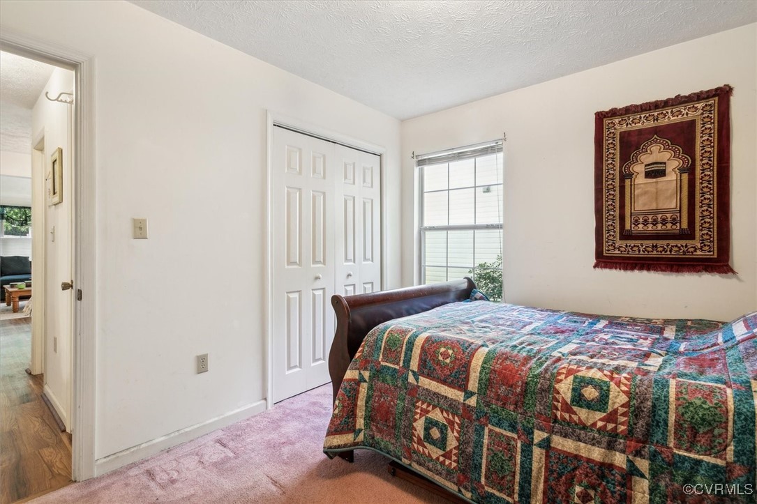147 Rain Tree Way Williamsburg, VA 23188 - Photo 20 of 36 a bedroom with a bed next to a window