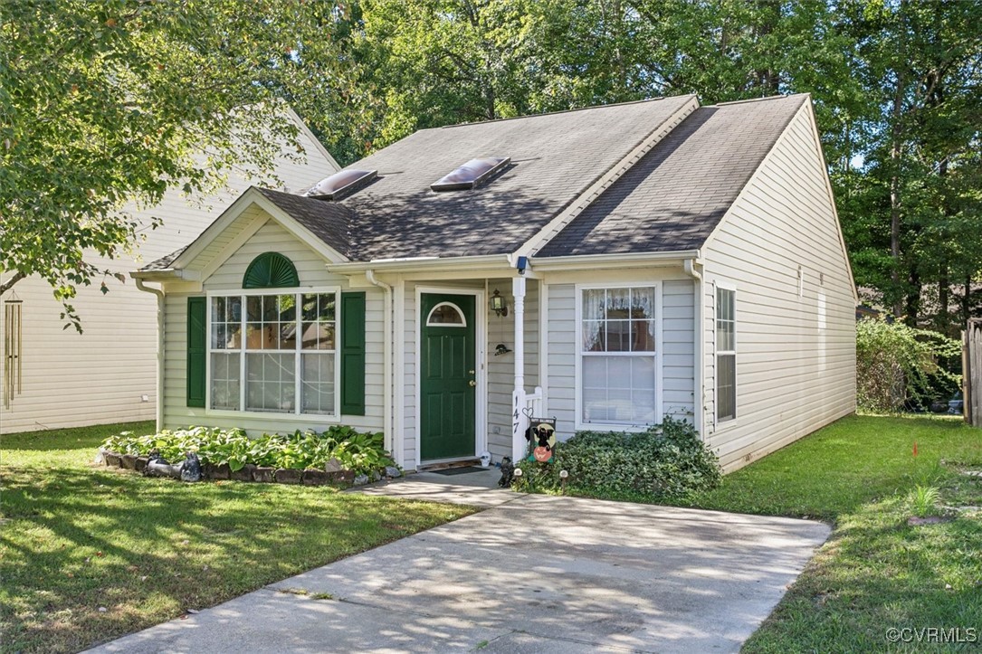 147 Rain Tree Way Williamsburg, VA 23188 - Photo 2 of 36 a front view of a house with a yard