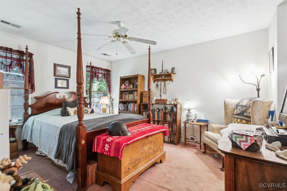147 Rain Tree Way Williamsburg, VA 23188 - Photo 21 of 36 a bedroom with a bed and dresser