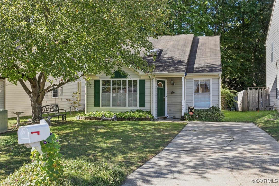 147 Rain Tree Way Williamsburg, VA 23188 - Photo 28 of 36 a front view of a house with a yard and trees