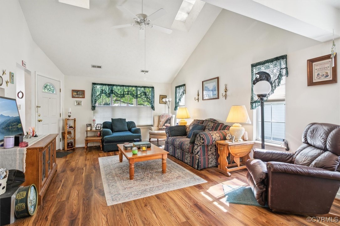 147 Rain Tree Way Williamsburg, VA 23188 - Photo 6 of 36 a living room with fireplace furniture and a large window