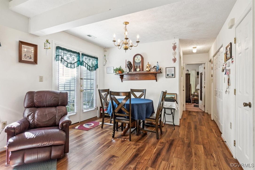 147 Rain Tree Way Williamsburg, VA 23188 - Photo 9 of 36 a view of a dining room with furniture and wooden floor
