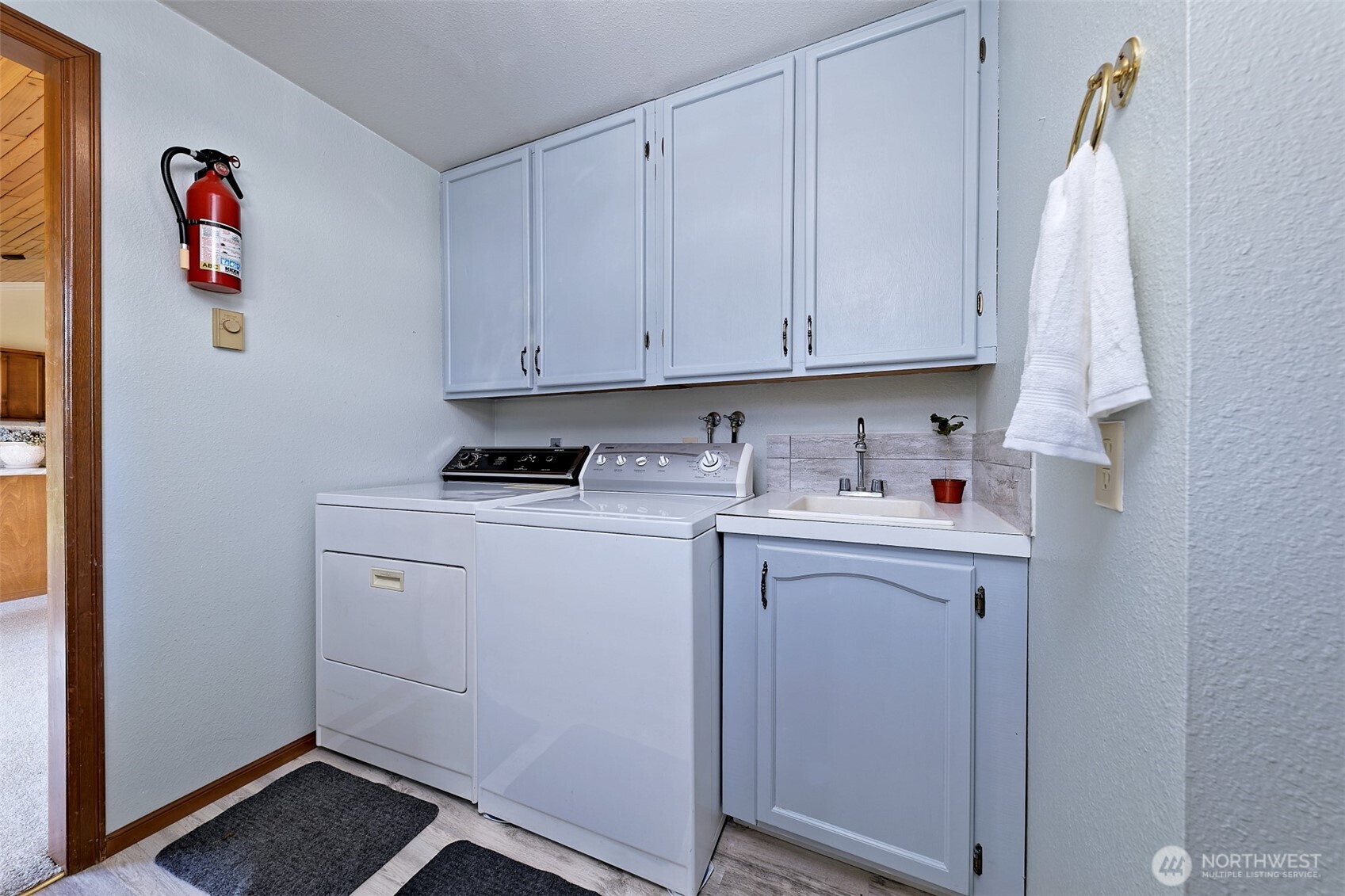 247-24 Woodard Road Chehalis, WA 98532 - Photo 23 of 40 a utility room with cabinets washer and dryer
