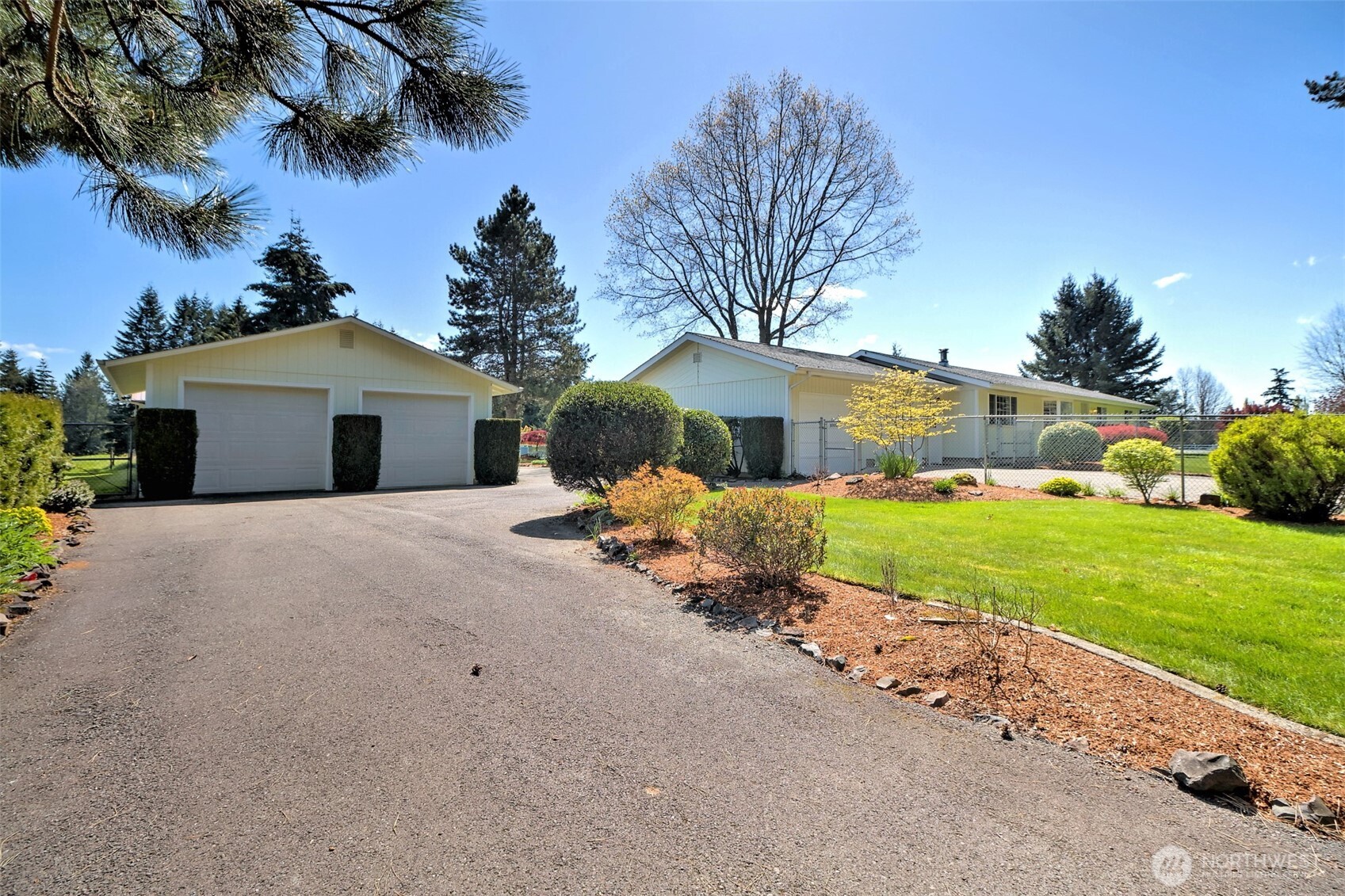 247-24 Woodard Road Chehalis, WA 98532 - Photo 3 of 40 a front view of a house with a yard and garage