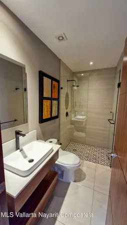 a bedroom with a bed and a television