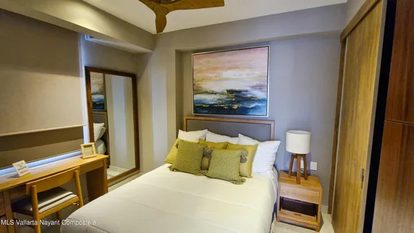 a bathroom with a shower toilet and a window