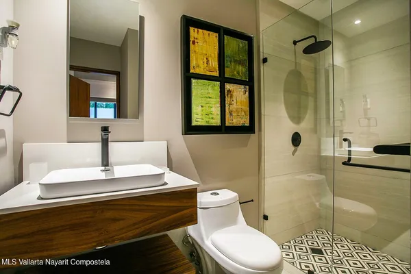 a bedroom with two beds and a window