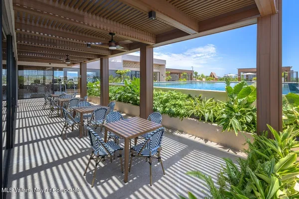 a room with gym equipment and a large window