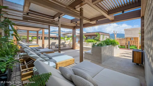 a outdoor space with lots of tables a garden view and chairs