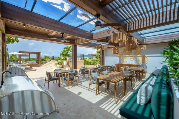 a view of a dinning table and chairs in the patio
