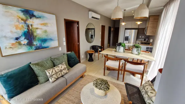 a view of a livingroom with furniture and a large window