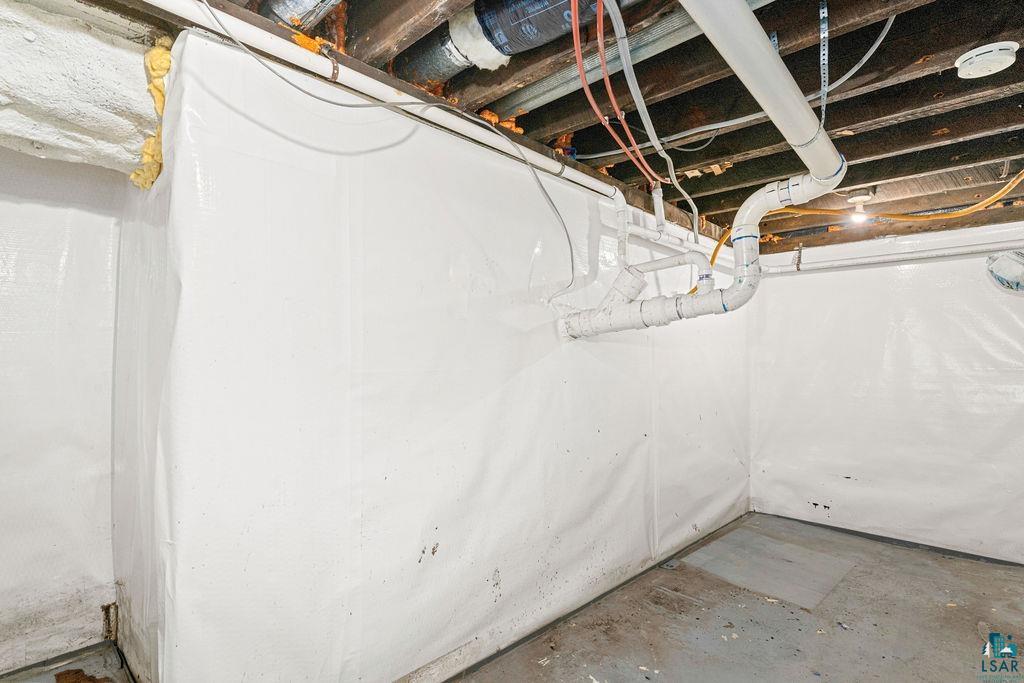 3949 East County Rd B Superior, WI 54880 - Photo 39 of 50 Crawl space featuring white encapsulation system and exposed ceiling joists