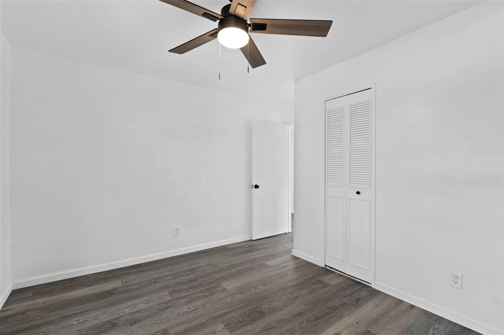 2068 East Peters Colony Road Carrollton, TX 75007 - Photo 10 of 24 a view of an empty room with wooden floor