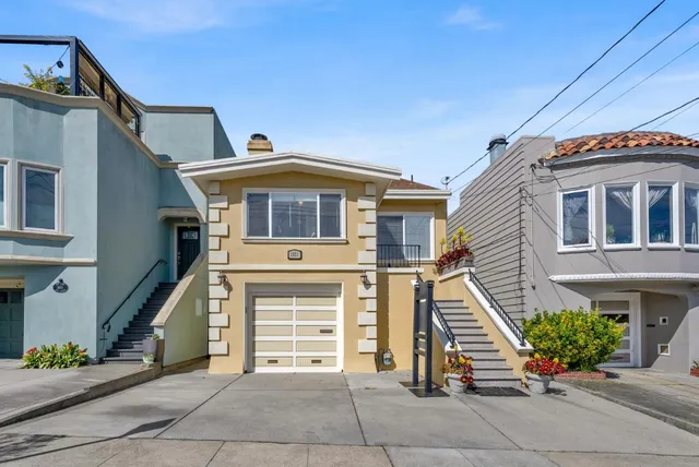 a front view of a house with a garage