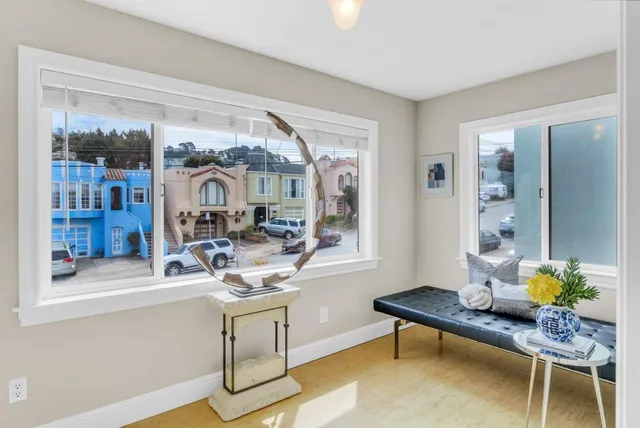 a bathroom with a toilet and mirror