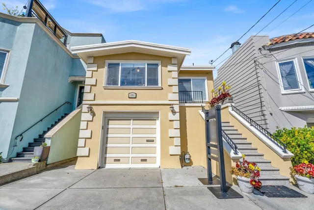 a front view of a house with a garage