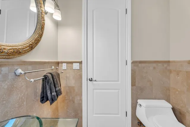 a living room with furniture and a dining table
