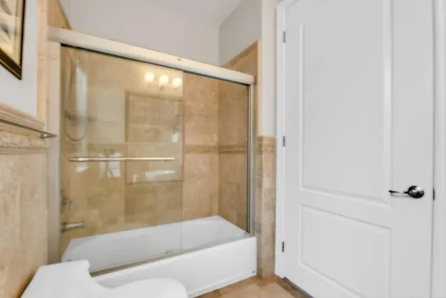 a view of a patio with table and chairs potted plants and palm tree