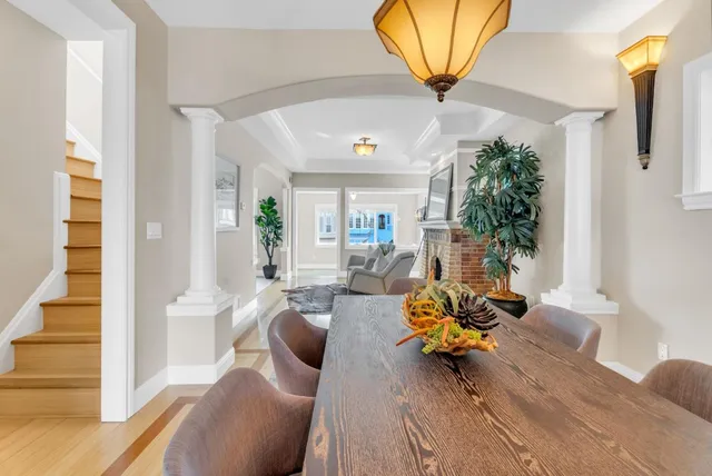 a view of a patio with table and chairs and potted plants
