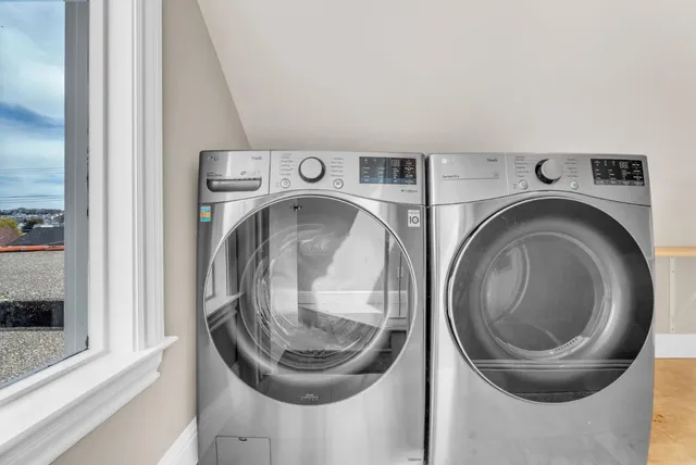 a view of a patio with table and chairs and potted plants