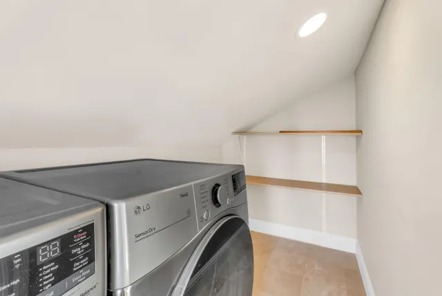 a view of a chair and table in backyard