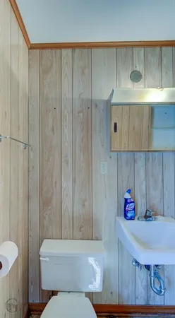 a bathroom with a toilet and shower