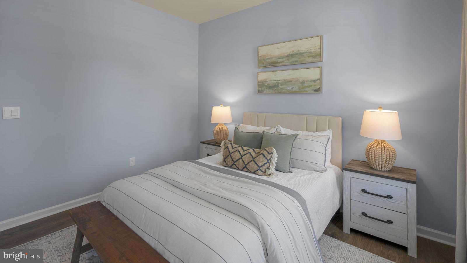 249 Hydrangea Way Winchester, VA 22602 - Photo 17 of 19 a bedroom with a bed and a lamp on dresser