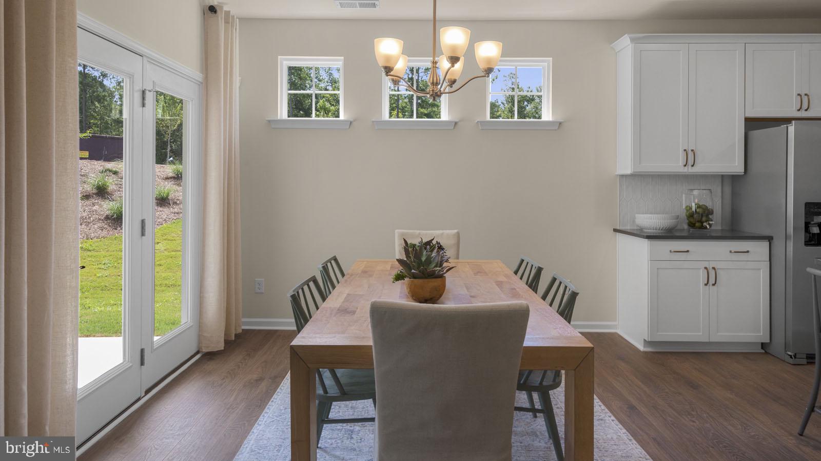 249 Hydrangea Way Winchester, VA 22602 - Photo 10 of 19 a dining room with furniture and window