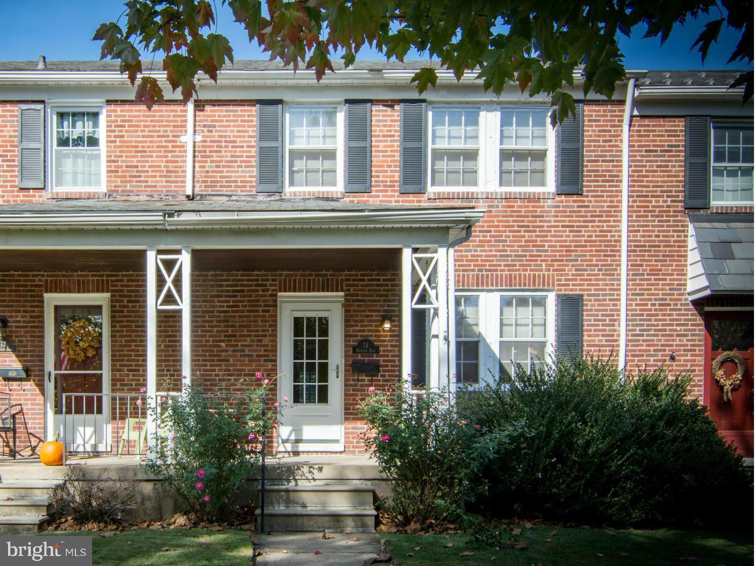 74 Murdock Road Baltimore, MD 21212 - Photo 1 of 30 front view of a brick house with a yard