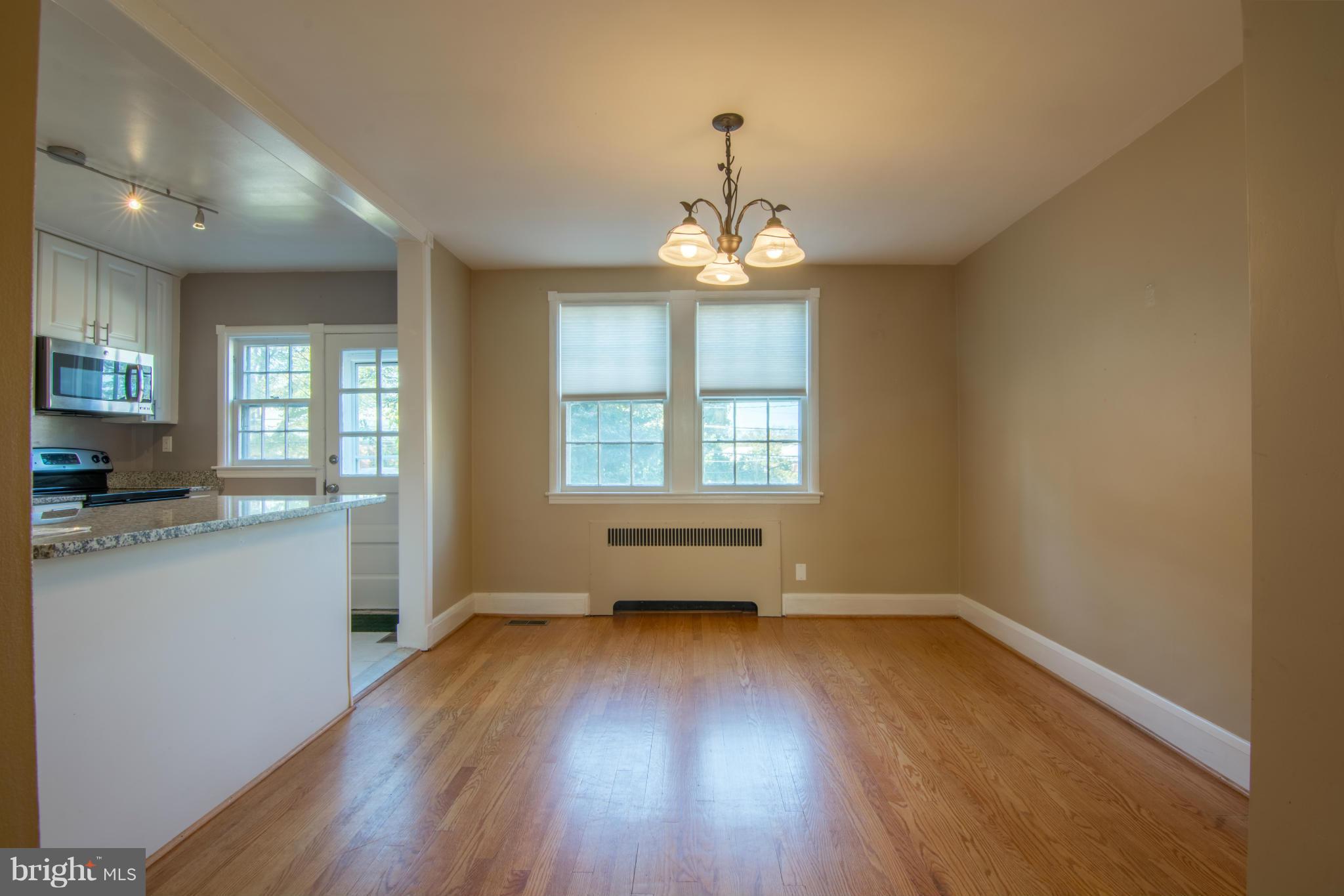 74 Murdock Road Baltimore, MD 21212 - Photo 11 of 30 a view of empty room with wooden floor and fan