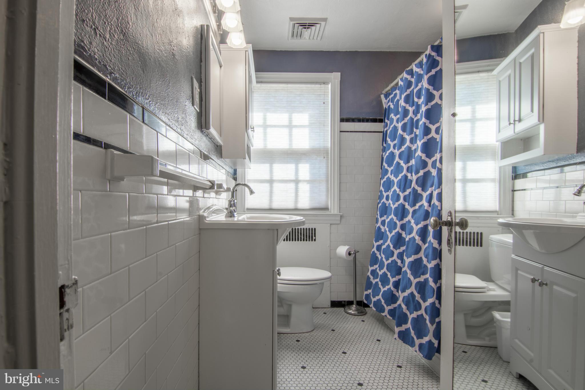 74 Murdock Road Baltimore, MD 21212 - Photo 16 of 30 a bathroom with a toilet sink and shower