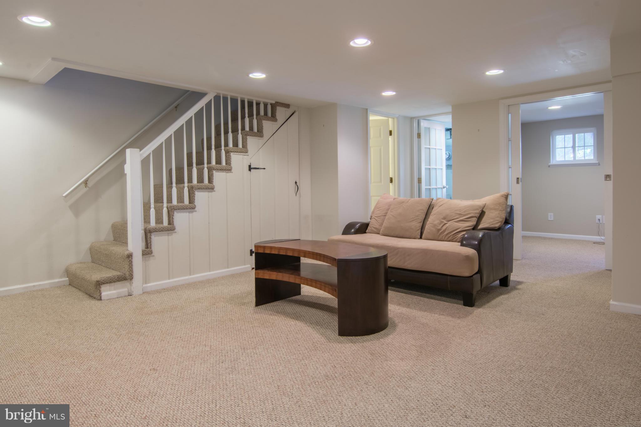 74 Murdock Road Baltimore, MD 21212 - Photo 20 of 30 a living room with furniture and stairs