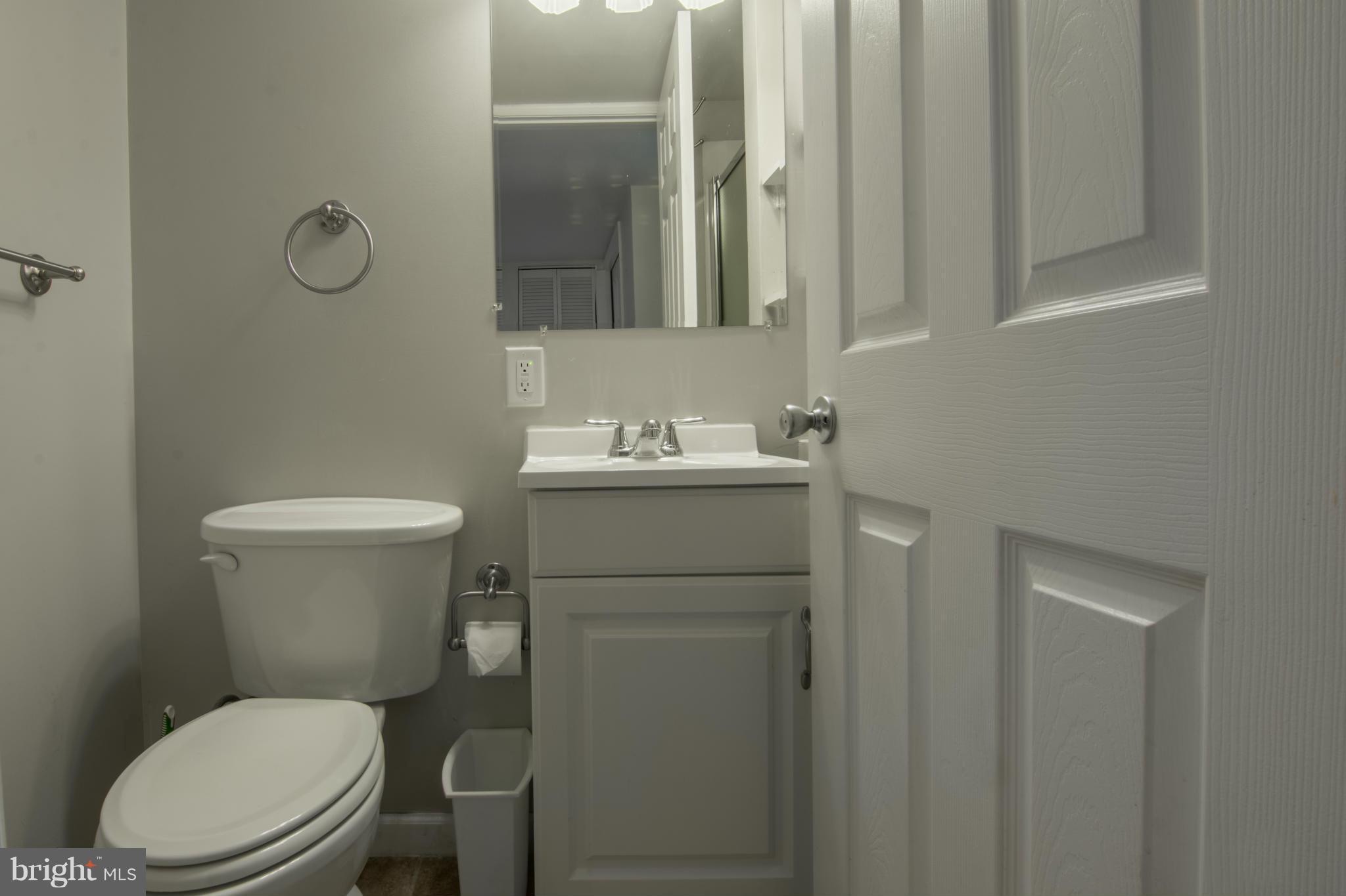 74 Murdock Road Baltimore, MD 21212 - Photo 24 of 30 a bathroom with a toilet sink and mirror