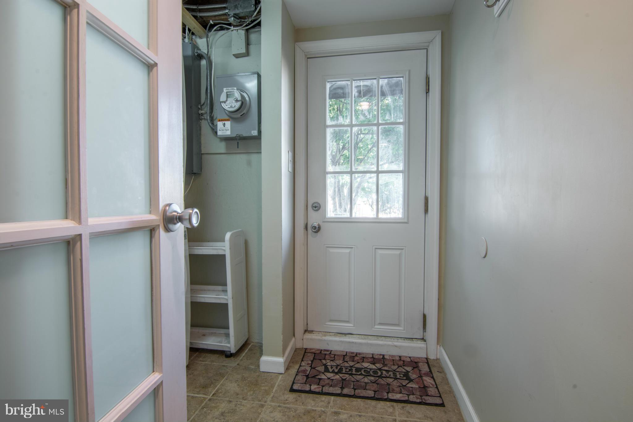 74 Murdock Road Baltimore, MD 21212 - Photo 25 of 30 a view of room with door and a window