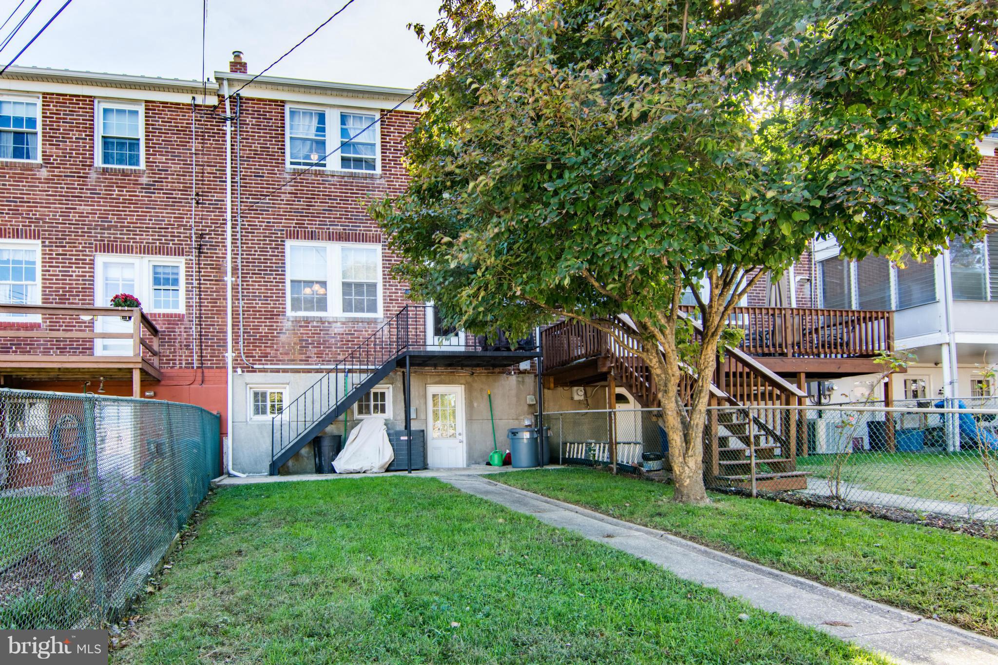 74 Murdock Road Baltimore, MD 21212 - Photo 28 of 30 front view of house with a yard and an trees