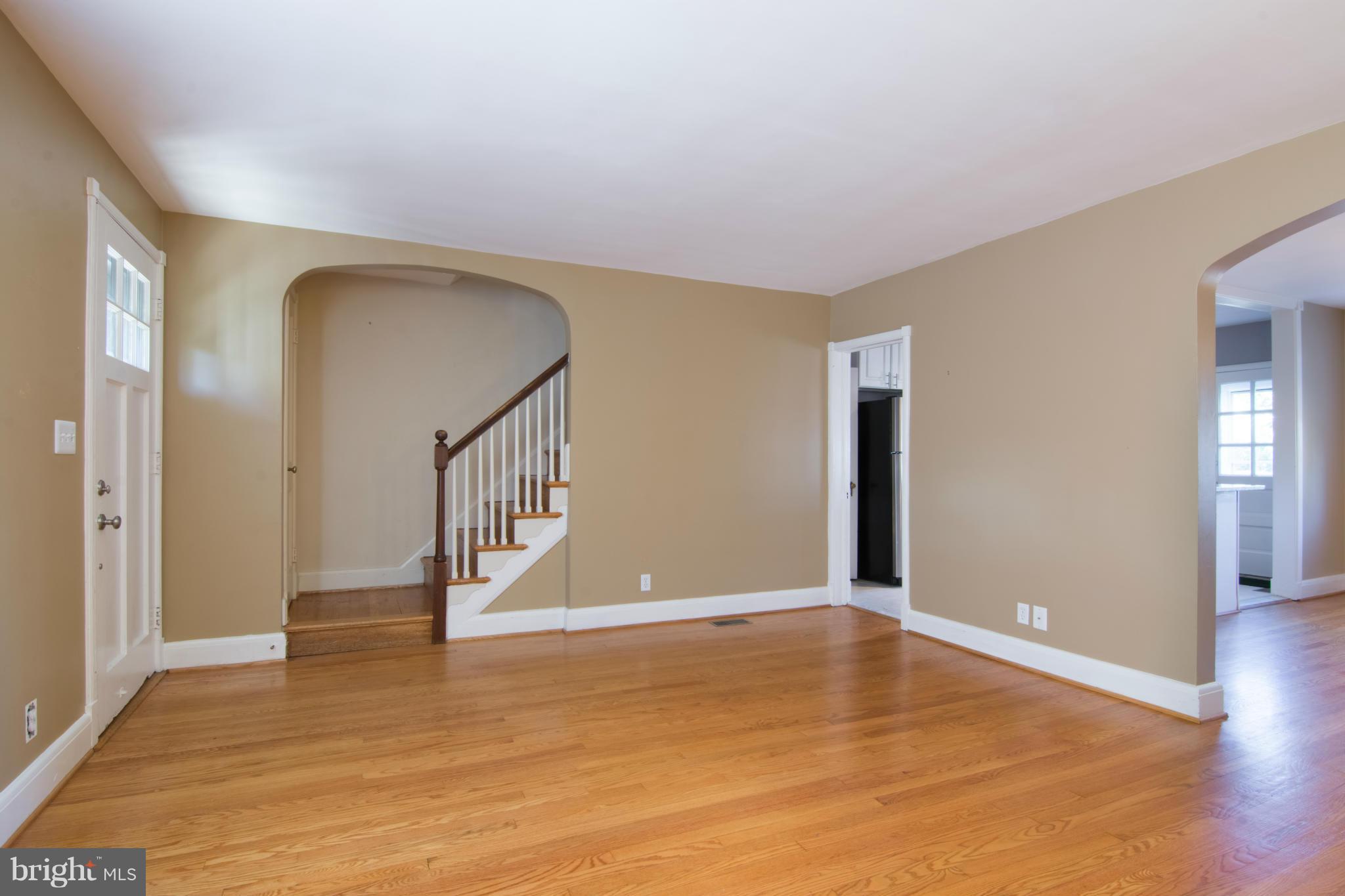 74 Murdock Road Baltimore, MD 21212 - Photo 7 of 30 a view of an empty room with wooden floor and a window